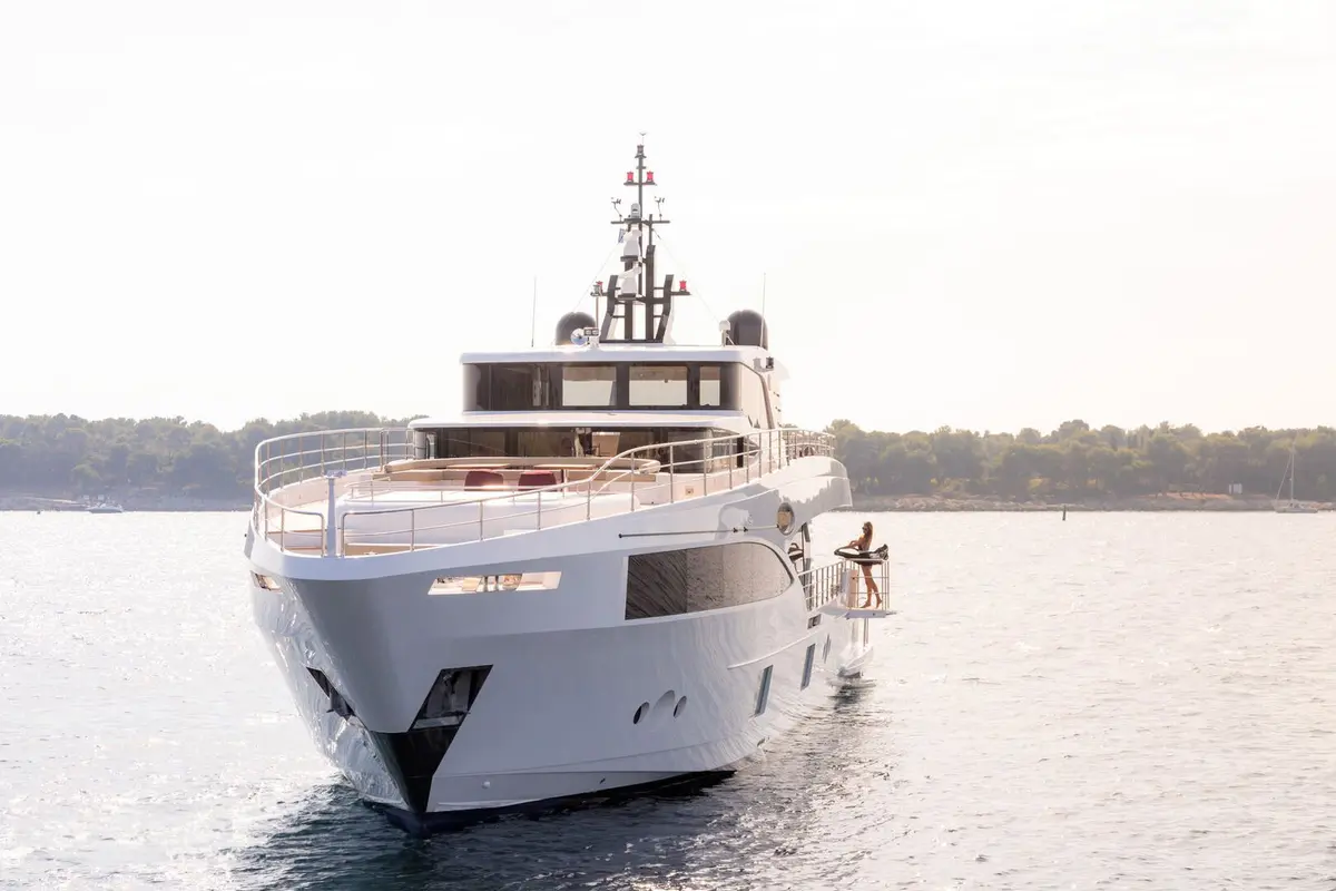 Majesty 100, exterior — Mallorca Yachst Hire, Mallorca. Wide decks tracing Formentor's cliffs at sunrise