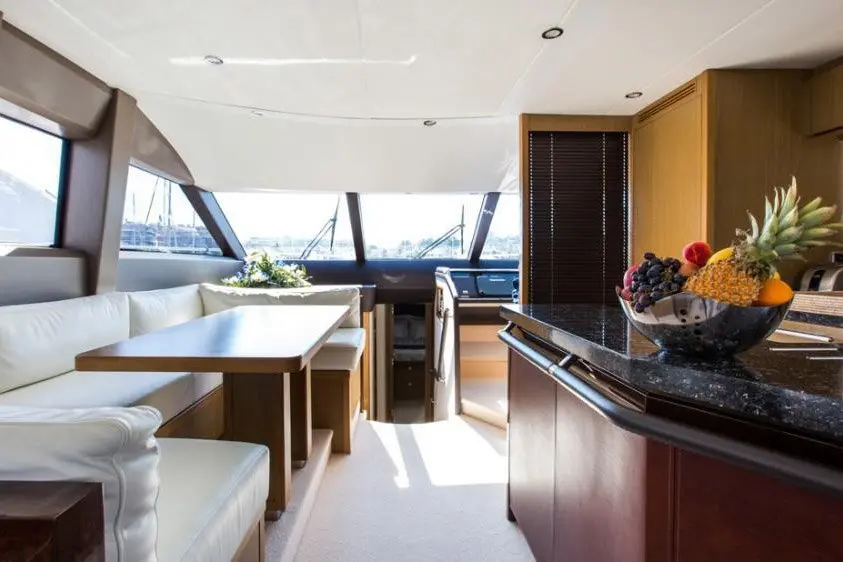 Princess 68 Fly, main deck — Mallorca Yachst Hire, Mallorca. Sunset runs along Illetes, flybridge open to the sky