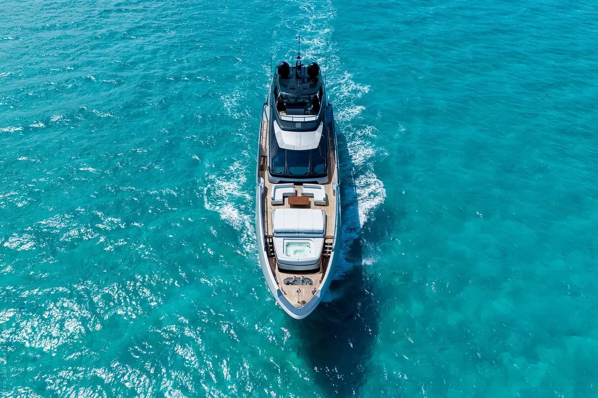 Riva 130, aft deck — Mallorca Yachst Hire, Mallorca. Forty metres tracing Formentor's cliffs at sunset