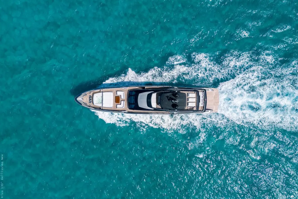 Riva 130, flybridge — Mallorca Yachst Hire, Mallorca. Forty metres tracing Formentor's cliffs at sunset