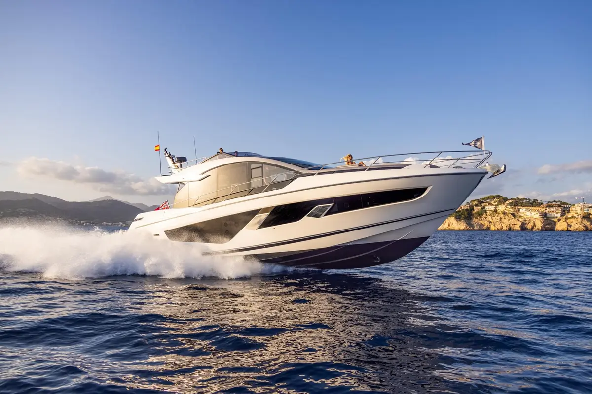 Sunseeker 65 Sport, main deck — Mallorca Yachst Hire, Mallorca. Sport-hull speed toward Illetes at sunset