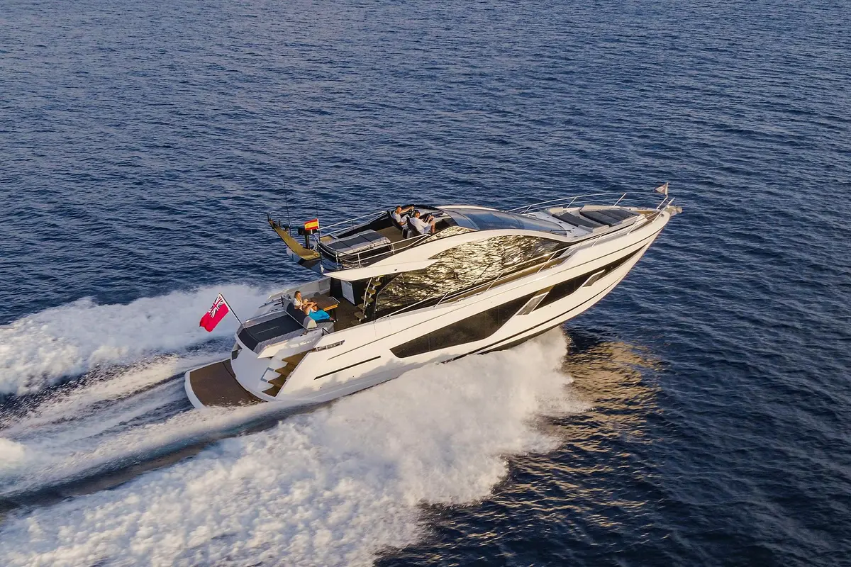 Sunseeker 65 Sport, aft deck — Mallorca Yachst Hire, Mallorca. Sport-hull speed toward Illetes at sunset